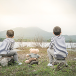 child-asian-with-teddy-bear-sitting-site-reservoir-is-background-1 1