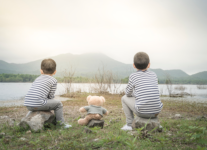 child-asian-with-teddy-bear-sitting-site-reservoir-is-background-1 1